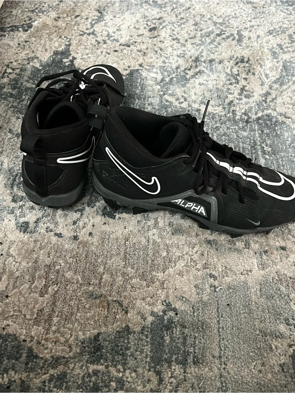 Nike Black Football Cleats with White Swoosh Accents